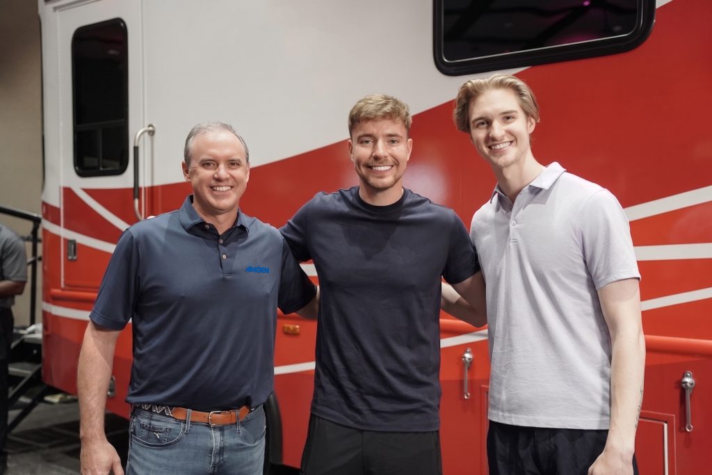 GREENVILLE, NC: L to R: Jay Bradner, M.D., EVP of Research and Development, AI and Data at Amgen, Jimmy (MrBeast) Donaldson, William Yank, cancer survivor and patient advocate Photo by: Rashaad McNeil
