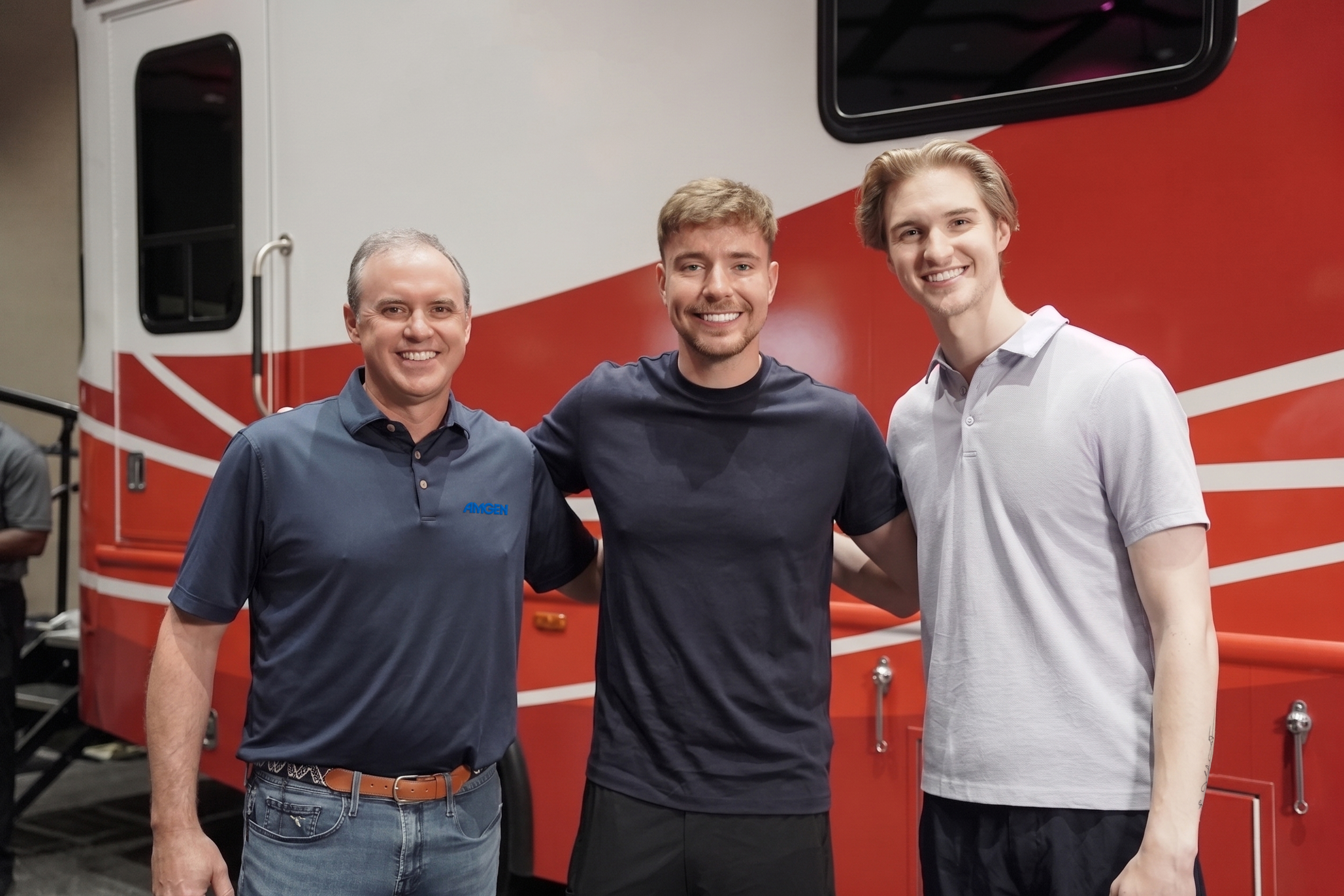 GREENVILLE, NC: L to R: Jay Bradner, M.D., EVP of Research and Development, AI and Data at Amgen, Jimmy (MrBeast) Donaldson, William Yank, cancer survivor and patient advocate Photo by: Rashaad McNeil
